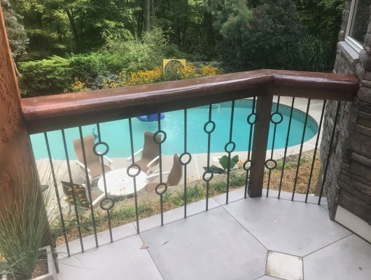 railing with pool in background